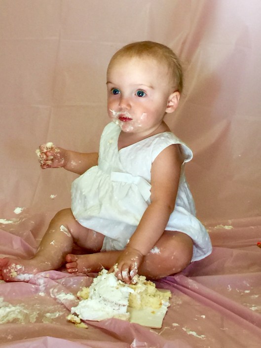 1-year old Greenlea eating her birthday cake.